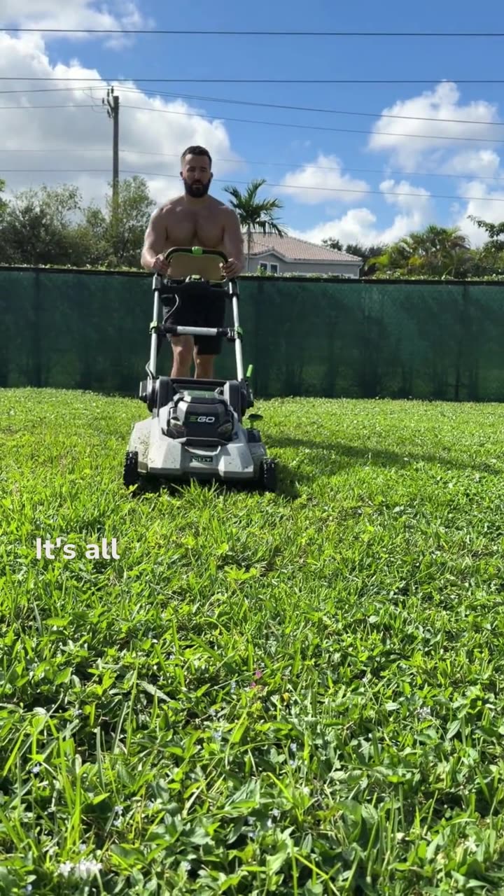 Justin mowing the lawn with an EGO cordless mower