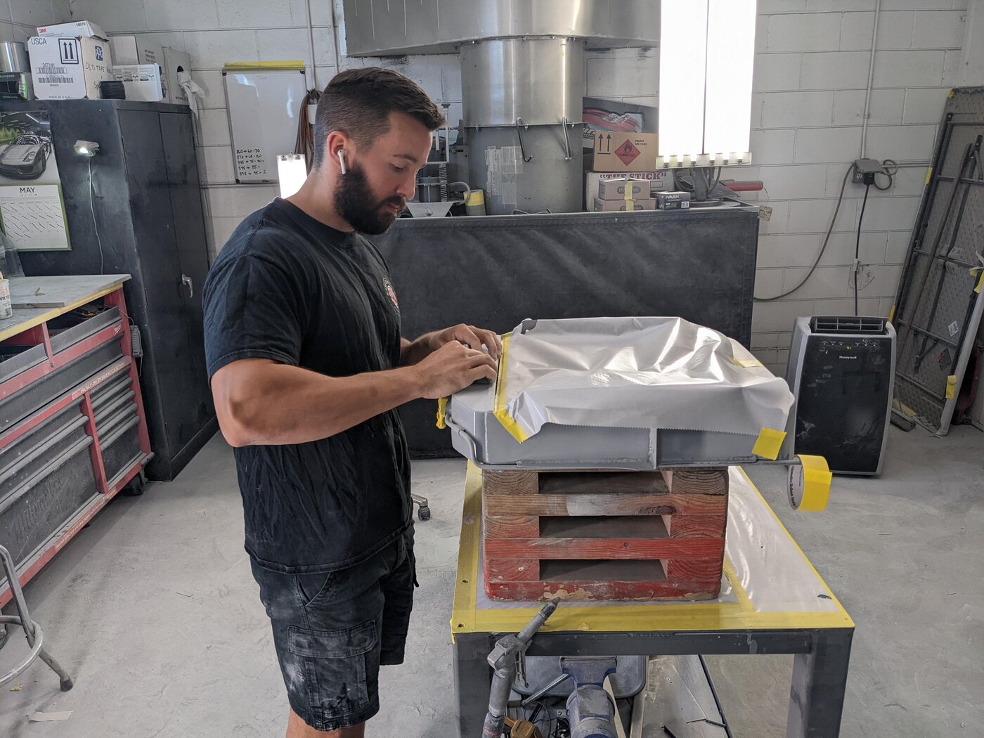 Justin working on a high-end automotive restoration project