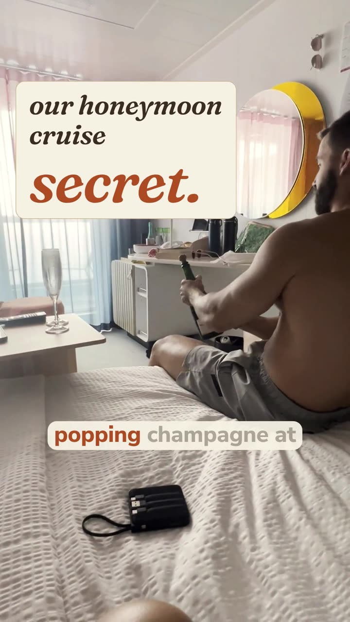 Justin popping champagne in our cabin, with the hook our honeymoon cruise secret